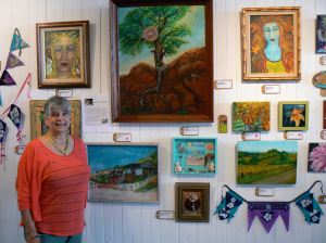 Me in front of my art wall